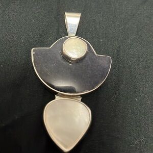 Obsidian black onyx and motherhood pearl pendant.